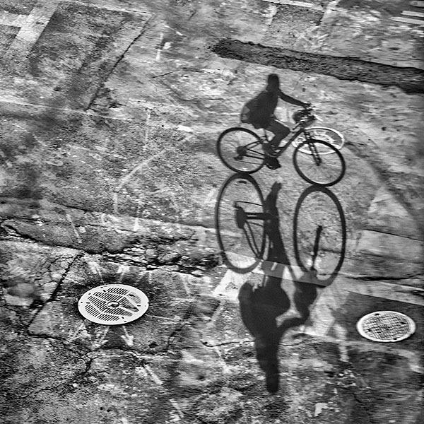 CYCLIST AND SHADOW - NYC - LARRY'S TENSET, 2014