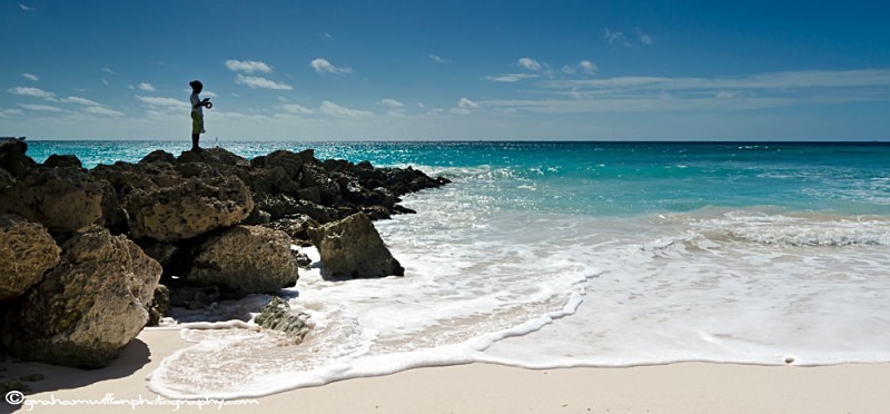 A single fisherman on Maxwell Beach, Barbados