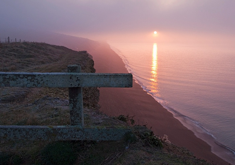 Sunrise through the fog at Hive Beach