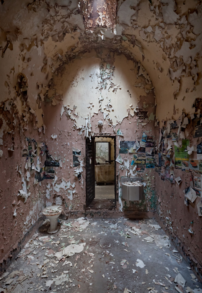 Cell with collaged walls, Holmesburg Prison, Philadelphia PA
