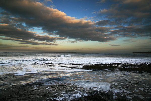 SUNSET ON THE SEA BAMBURGH - NORTHUMBERLAND