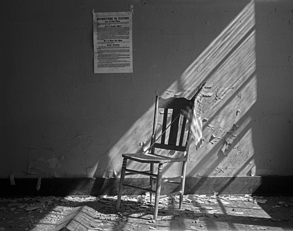 Interior with chair and flag. - Abandoned America