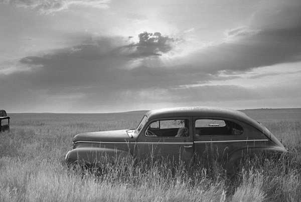 Car and backlit sky - Abandoned America