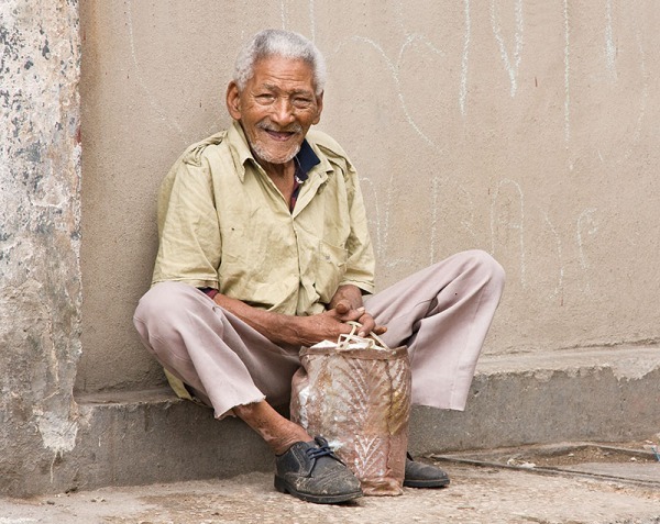 Man on a Curb, Havana - PORTRAITS AND CANDIDS