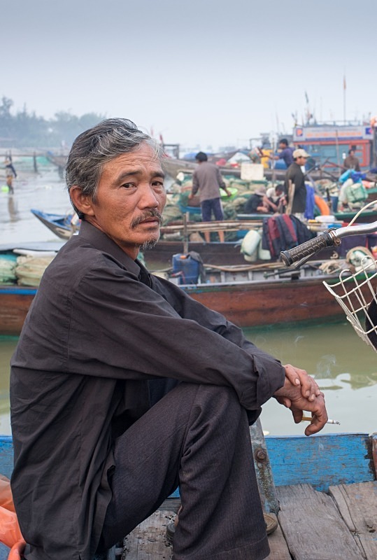 Man on a ferry, Thu Bon River - Vietnam January 2013