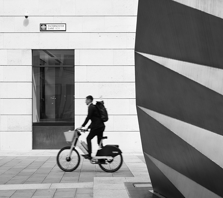 Cycling by Angel's Wings - Street Photography