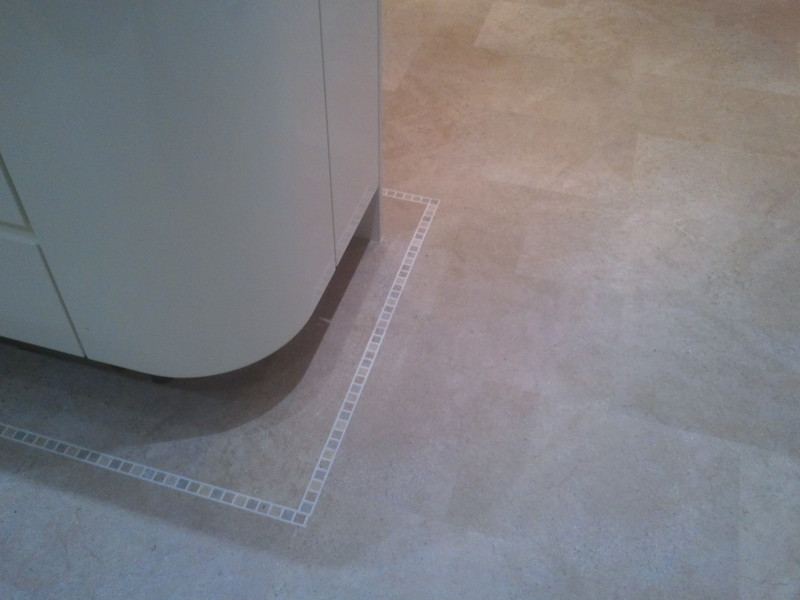 Decorative borders can add a stylish touch. - Karndean tile and stone effect