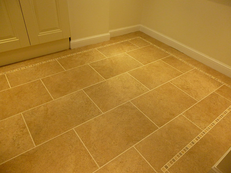 ST 12 with DS10 design strips and light mosaic border - Karndean tile and stone effect
