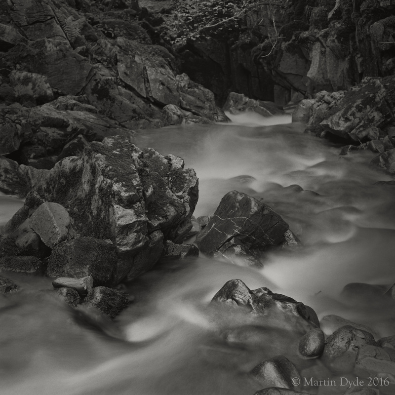 Stream plunging into limestone cave, Cwm Pwll-y-Rhyd, Brecon Beacons, Wales | The Silver Monochrome: black-and-white film photography by Martin Dyde
