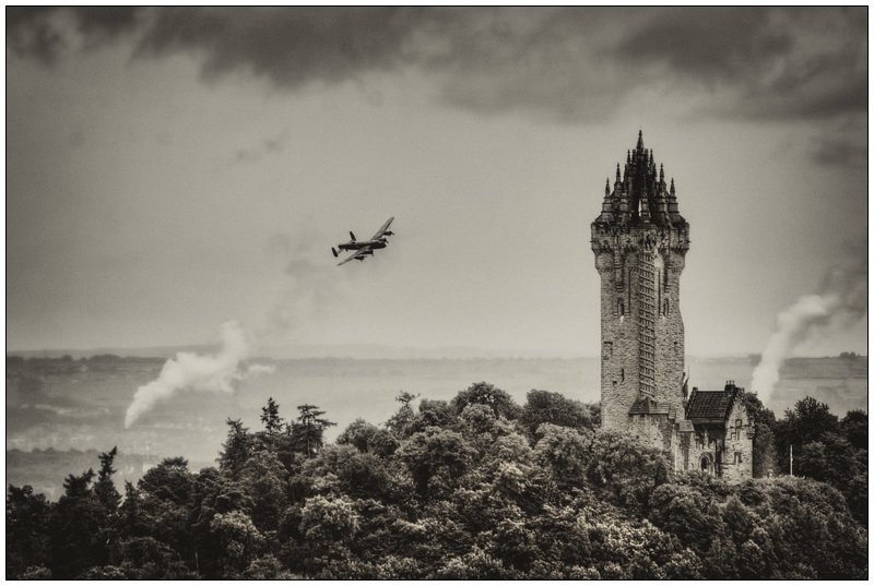 Lancaster bomber over Wallace monument - Clackmannan & Stirlingshire
