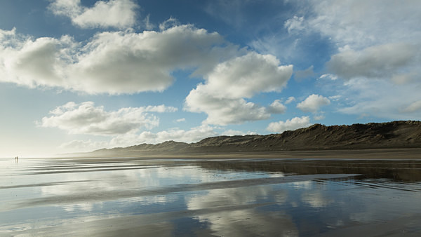 Sand reflections and spray, Muriwai - New Zealand