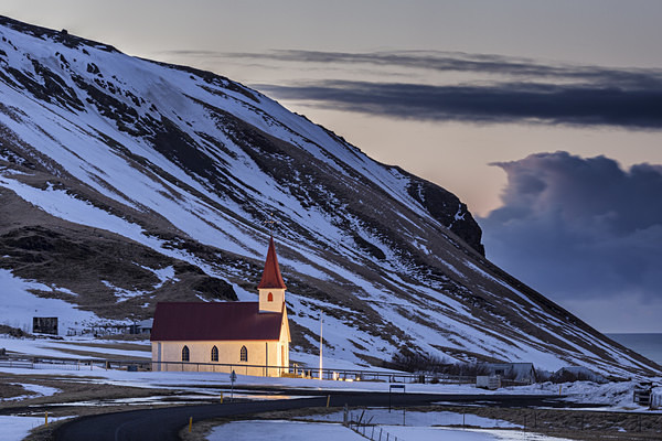 Floodlit church near Halfsanefs Hellir Beach - Iceland winter