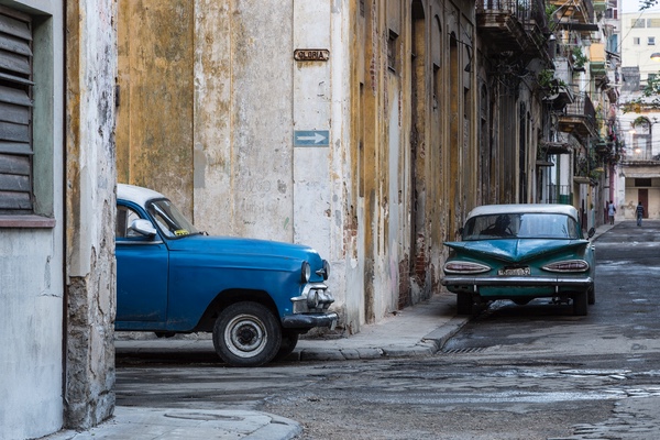 Old cars on the corner of Gloria, Havana - Cuba