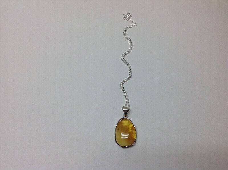 £56.00 including 16' silver chain - Amber Pendants