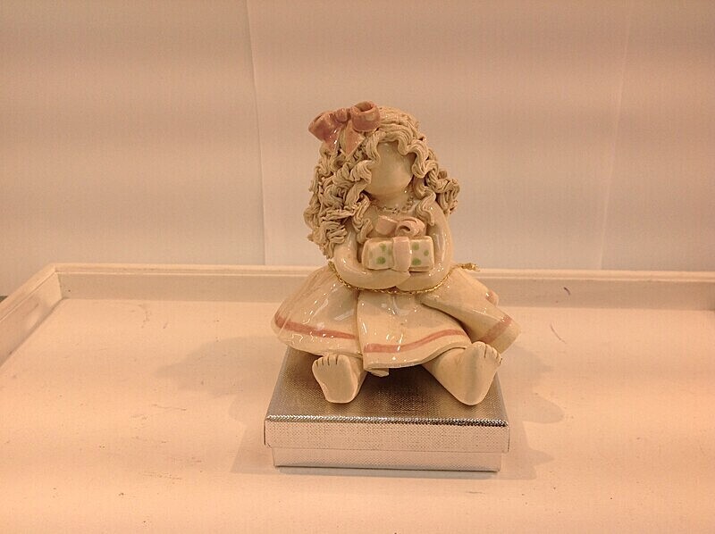 Rachael with gift.  4' tall. £42.00 - Barbara Lea Pottery