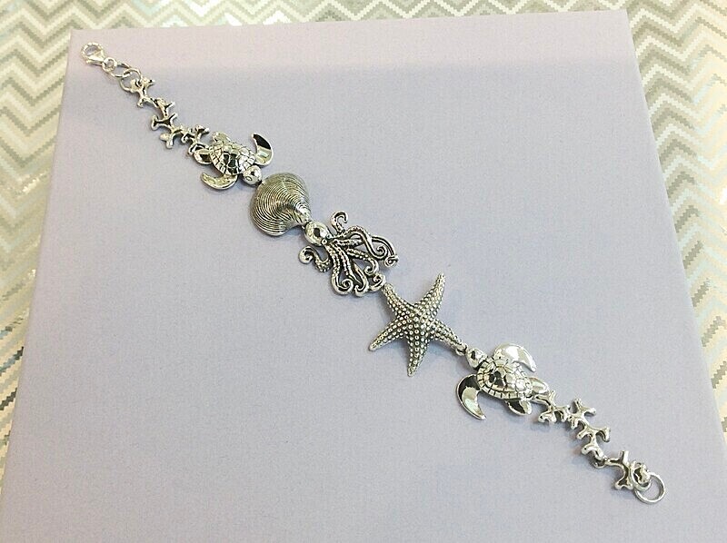 Silver sea side design bracelet.   £129.00 - Introducing our new silver collection