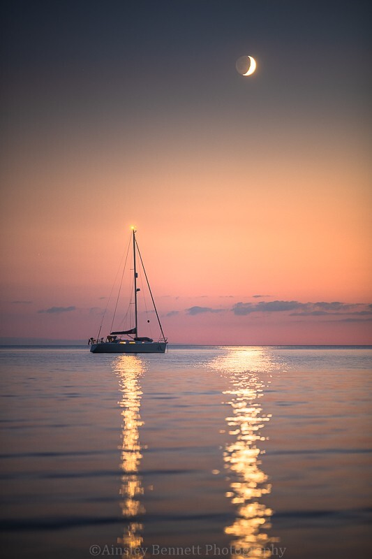 ab638 Lone yacht under the Crescent Moon - The Isle of Wight by night