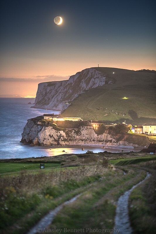 ab637 The crescent Moon over Tennyson down - The Isle of Wight by night