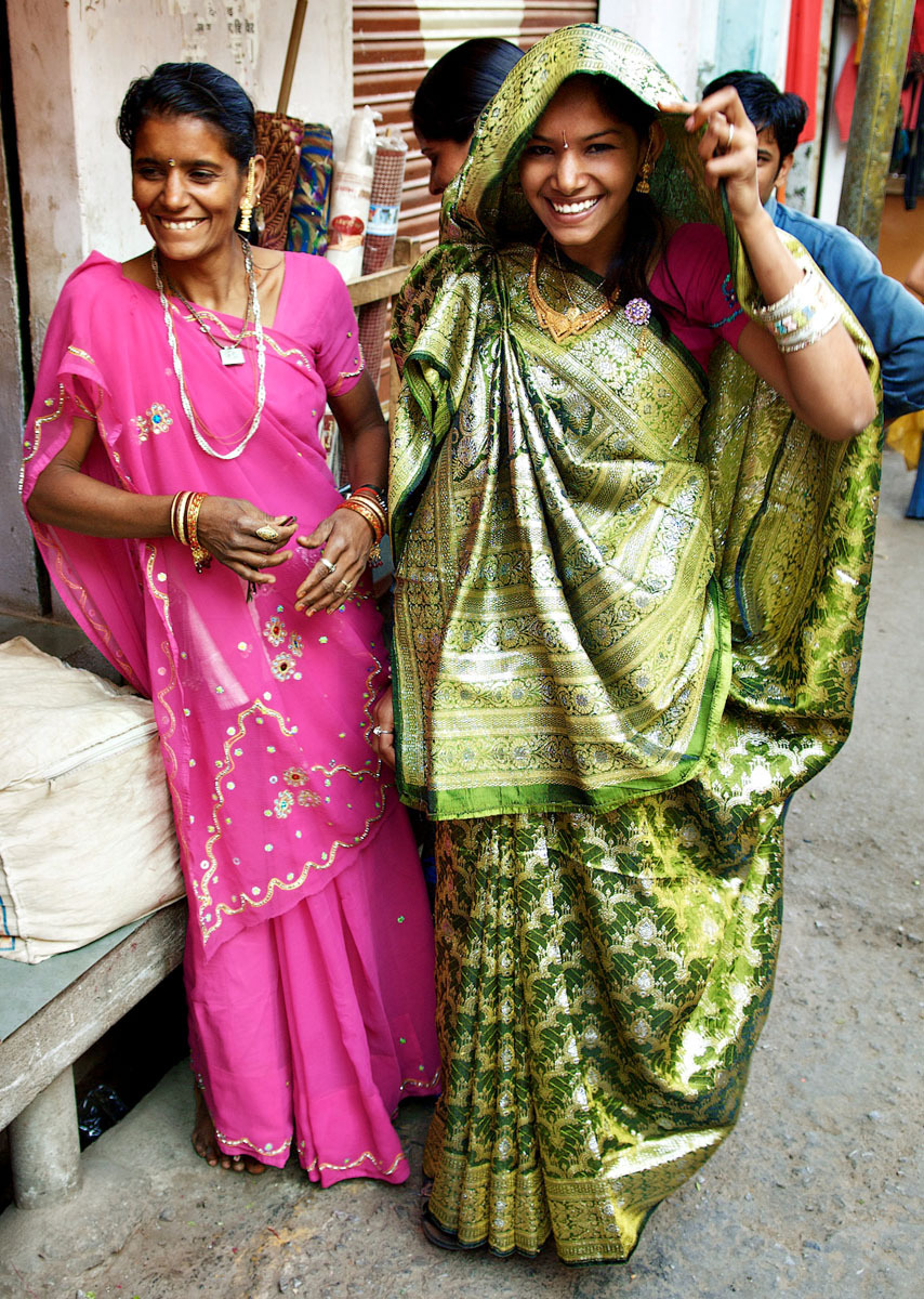 Deogarh, Rajasthan - bride being fitted for her wedding sari - India