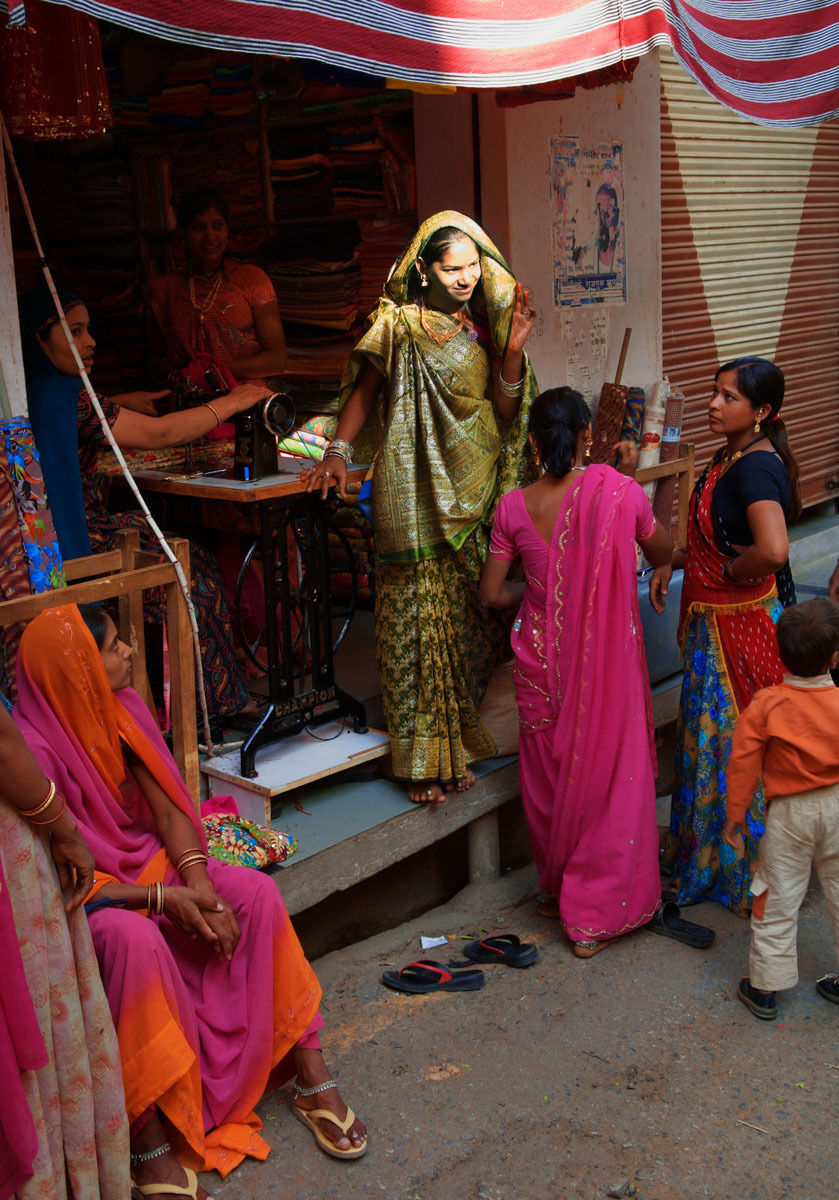 Deogarh, Rajasthan - bride being fitted for her wedding sari - India