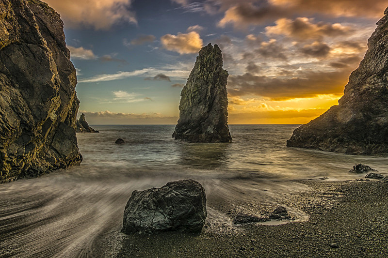 Sunset at Hidden Cove at Copper Coast Drive, Ireland. - All of the Rest Counties