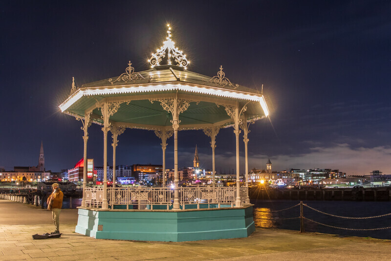 Busker at the Dun Laoghaire Bandstand, Dublin by Irish Outdoor Photographer Adrian Hendroff - Landscape and Outdoor Photography in Ireland