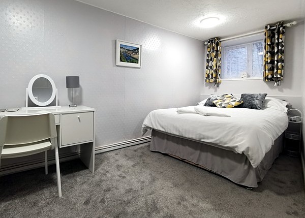 One end of the double bedroom - More photos of Dolphins Holiday Let