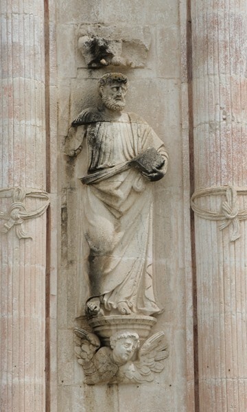 Façade portal, left intercolumniation statue, St. Peter - Façade, exterior buttressing, lateral portal, open & posa chapels, atrio & cross