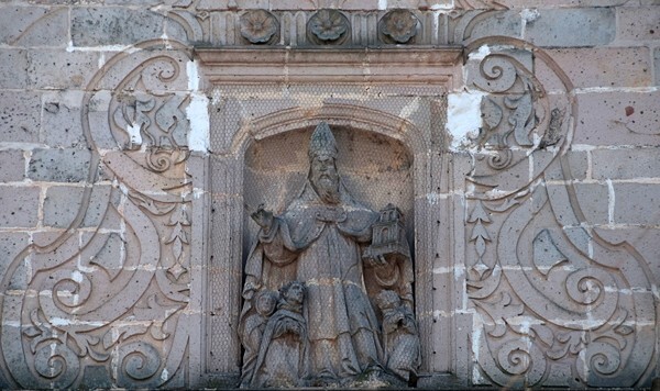 Central relief, St. Augustine - San Miguel Arcángel, façade & portería