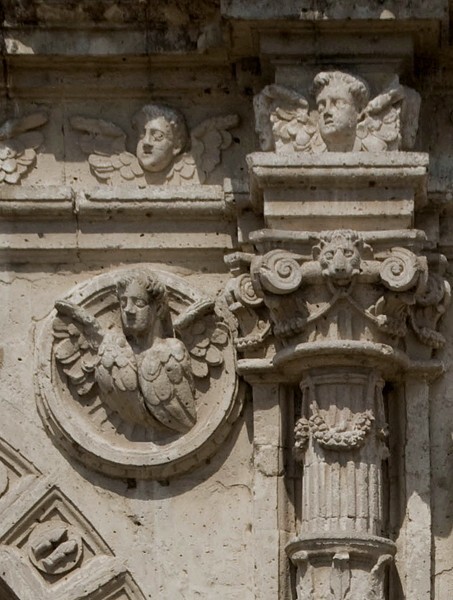 Façade portal, right spandrel roundel, seraph - San Pablo, façade, portería & convento