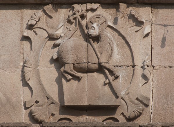 San Juan Bautista, façade architrave relief, lamb of God - Coyoacán, D.F.