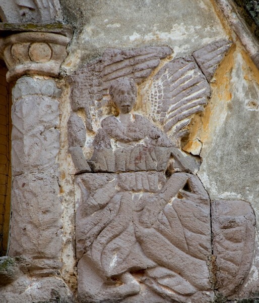 Porciúncula door detail, Passion angel (right) - La Asunción de Nuestra Señora (Catedral), façade, porciúncula door, capilla abierta, cloister