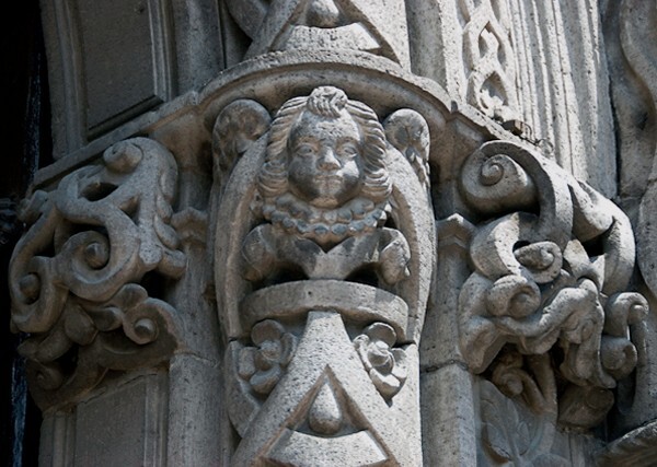 Façade portal, pillar capital relief, cherub - East (main) & South façades