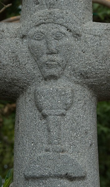 Atrial cross front, face of Christ & chalice - San Martín, façade, posa chapel & atrial cross
