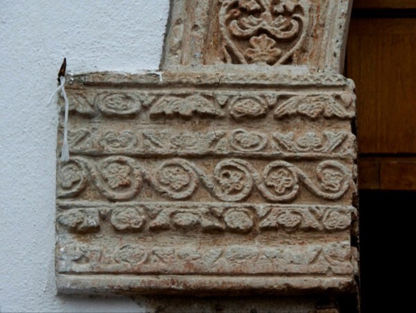 Façade portal, left pilaster impost - El Señor de la Salud