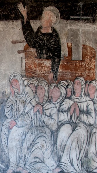 S wall mural, friar pieced by arrow, detail - San Miguel Arcángel, cloister with murals
