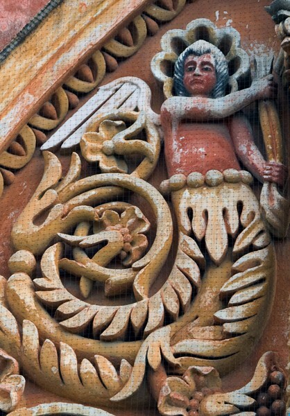 La Tercera Orden, second story left, winged merman - Façade, lateral portal & sacristy door