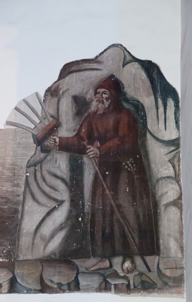 Nave wall St. Christopher mural, hermit with staff & lantern - Santiago