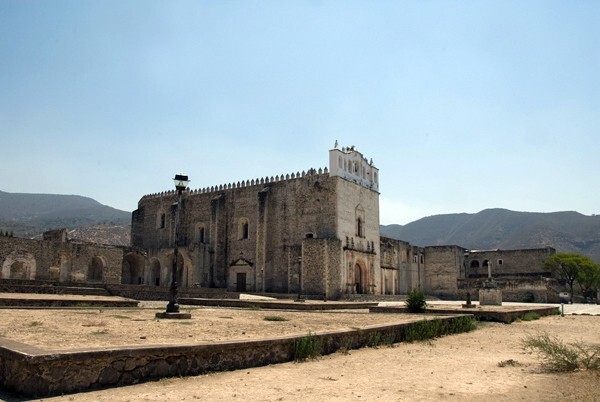 Church & atrio - Façade, exterior buttressing, lateral portal, open & posa chapels, atrio & cross
