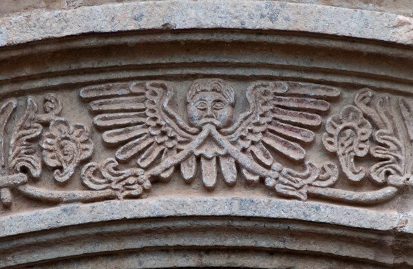 Façade portal, archivolt keystone relief - Façade, nave & sanctuary