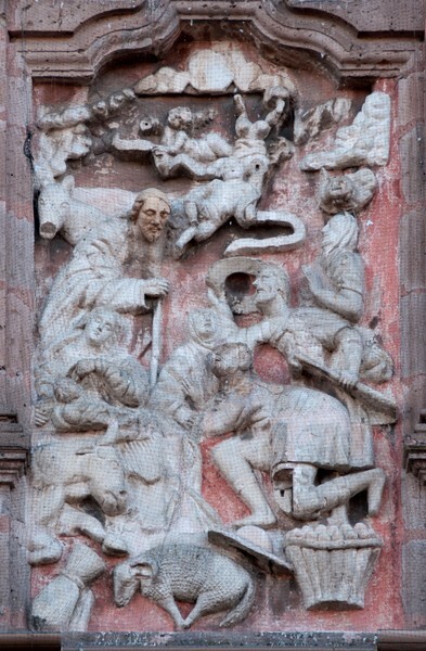 La Transfiguración de Cristo, façade, left portal relief - La Transfiguración de Cristo