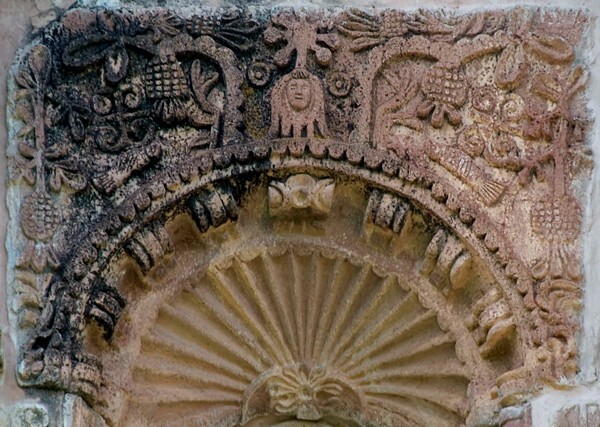 Second tier, sculpture niche (left) relief - Façade