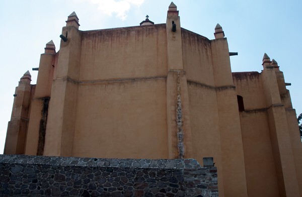Apse - Façade, lateral portal, gate cross, posa chapel, apse & atrial wall