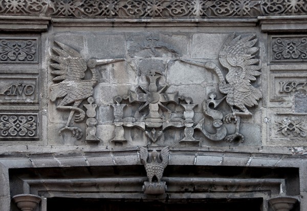Portal architrave relief with Christogram & date (1683) - Casa de las Cigüeñas