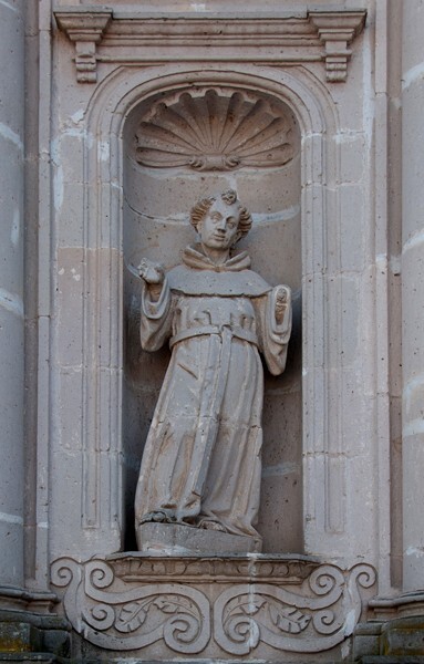 Lower left sculpture, St. Nicholas of Tolentino - San Miguel Arcángel, façade & portería