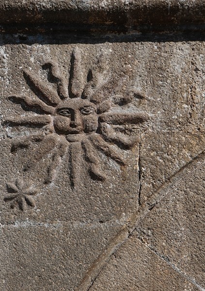 La Concepción, façade, main portal, left spandrel relief, sun - Chiautempan, Tlaxcala