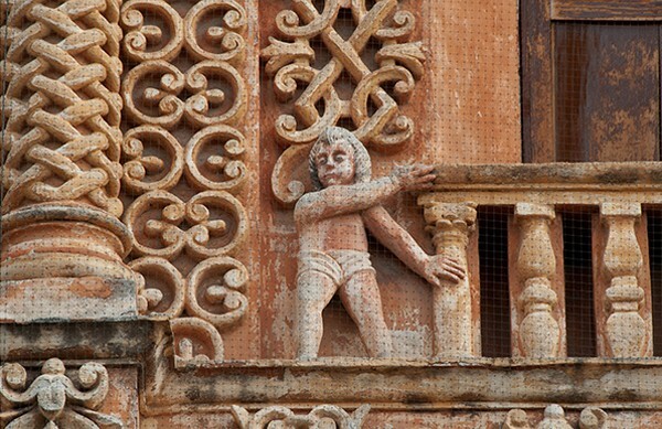 Tercera Orden, upper façade, choir loft window balcony & putto - Façade, lateral portal & sacristy door