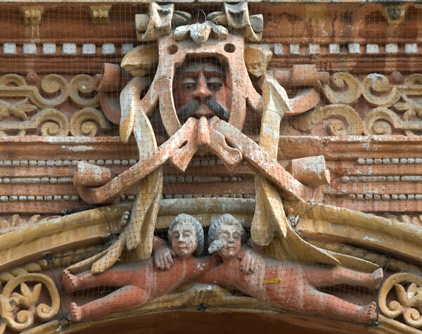 La Tercera Orden, façade, main portal, architrave relief - Façade, lateral portal & sacristy door