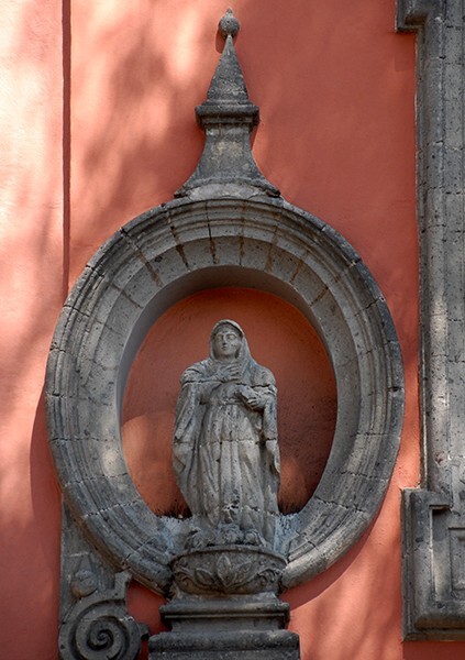 Façade, second tier roundel left, St. Cosmas - San Rafael