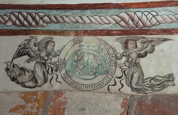 Lower cloister walk, portal mural, Marian insignia - San Juan Bautista, cloister & murals